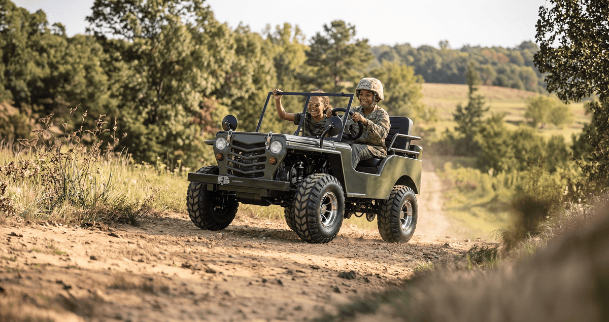 Kids riding the IceBear PAZ125-1 Jeep on a trail