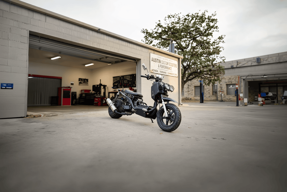 IceBear Maddog Gen I 150cc Scooter (PMZ150-19) - Maddog Gen I Scooter in front of an Austin garage